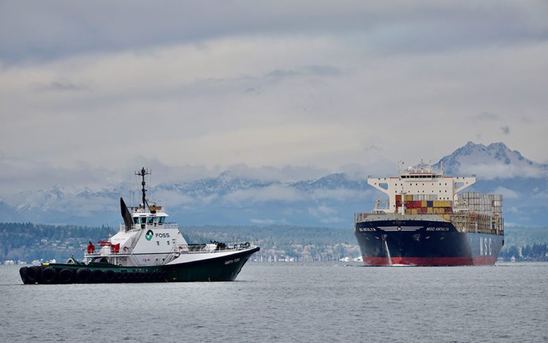Garth Foss meets the inbound MSC Antalya near downtown Seattle in early 2019. Foss will contract with other West Coast shipyards to maintain its tugboat fleet.