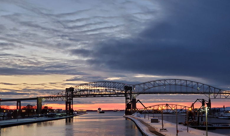 he documents her travels on social media with images that include sunset over the Soo Locks.