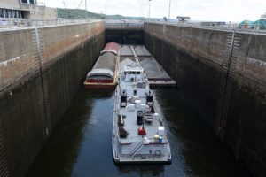 The towboat Cumberland Hunter moves through Kentucky Lock in 2017. The lock structure on the Tennessee River will receive $465 million for upgrades.