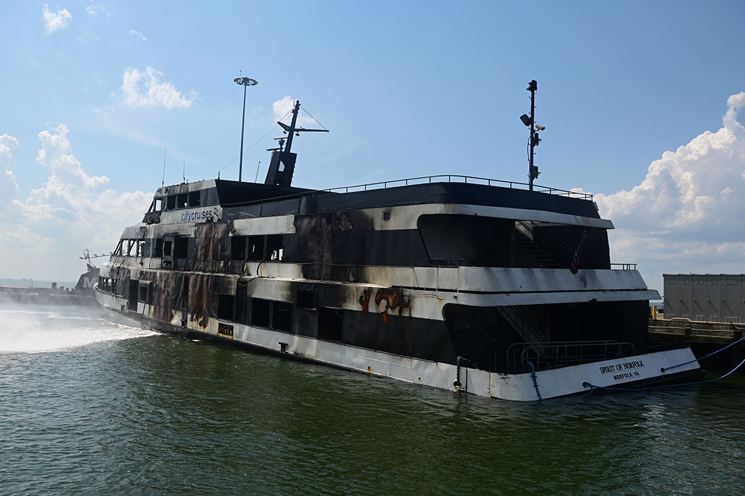 Spirit of Norfolk sits low in the water, above, after several days of firefighting.