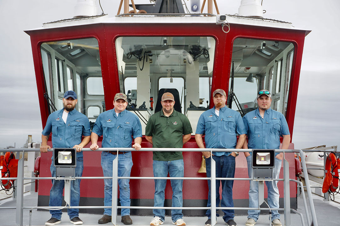 Moran’s Port Arthur crew includes, from left, deckhand Michael Roy, chief engineer Jeff Wesney, Capt. Clark, mate Greg Bedsole and mate Chris Blakesley.