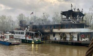 Fire gutted the towboat Miss Dorothy. The crew escaped to its barge tow and avoided serious injuries.