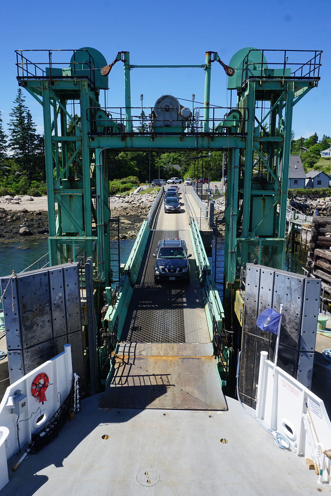 Vehicles drive onto the ferry from Vinalhaven