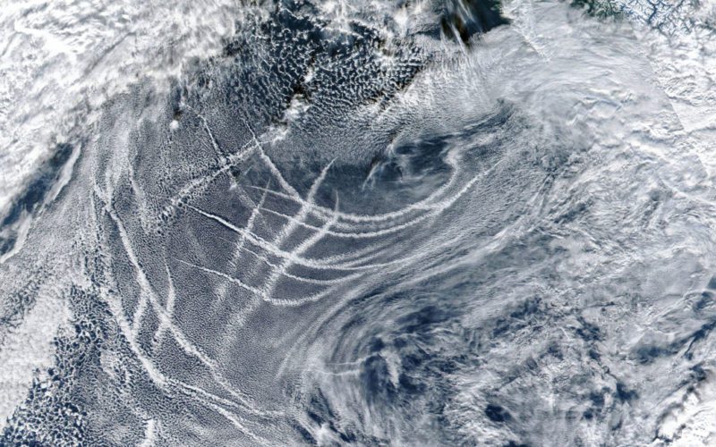 The white streaks across the image show ship tracks off the U.S. and Canadian west coast. Mandated changes to sulfur levels in fuel has resulted in less of these formations.