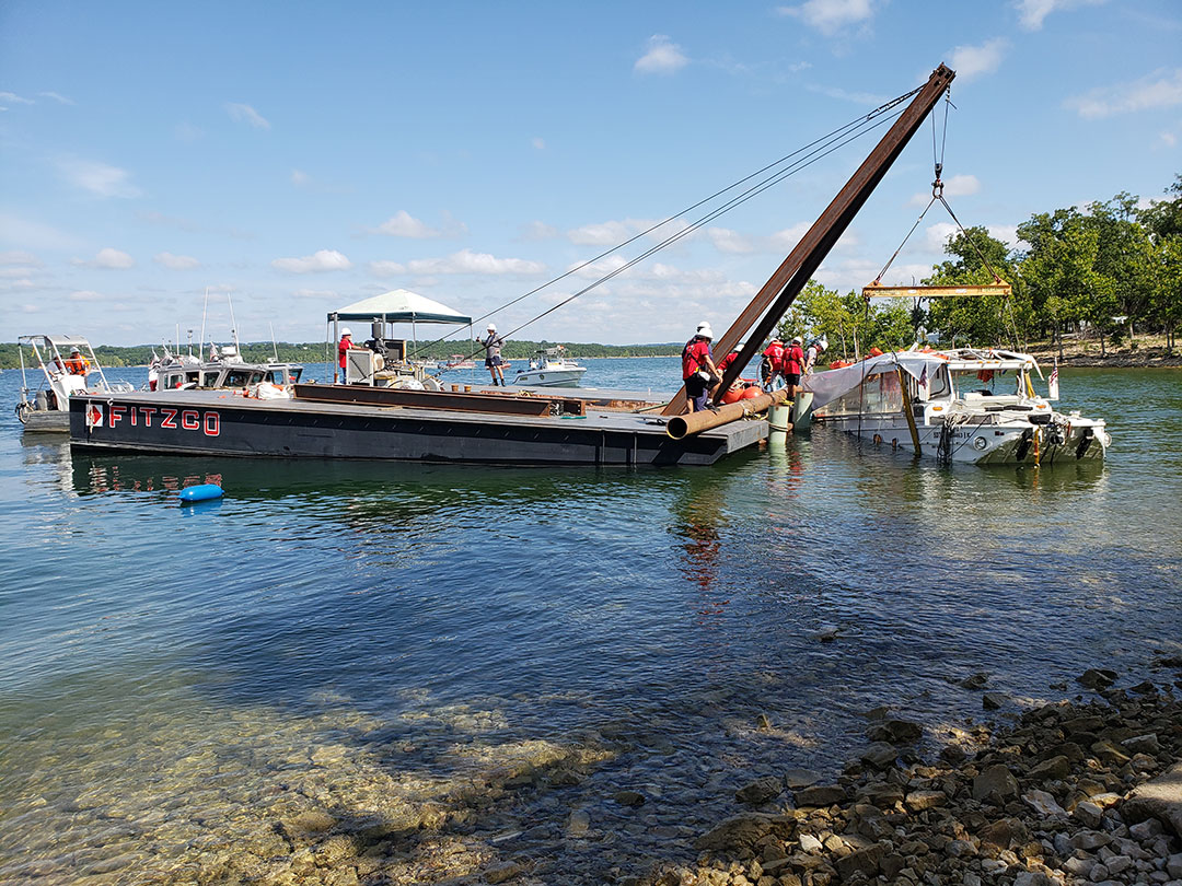 Salvage crews raise Stretch Duck 7 from Table Rock Lake in 2018 after a sinking that left 17 people dead. Legislation passed by Congress requires the Coast Guard to enact new safety rules for duck tour vessels