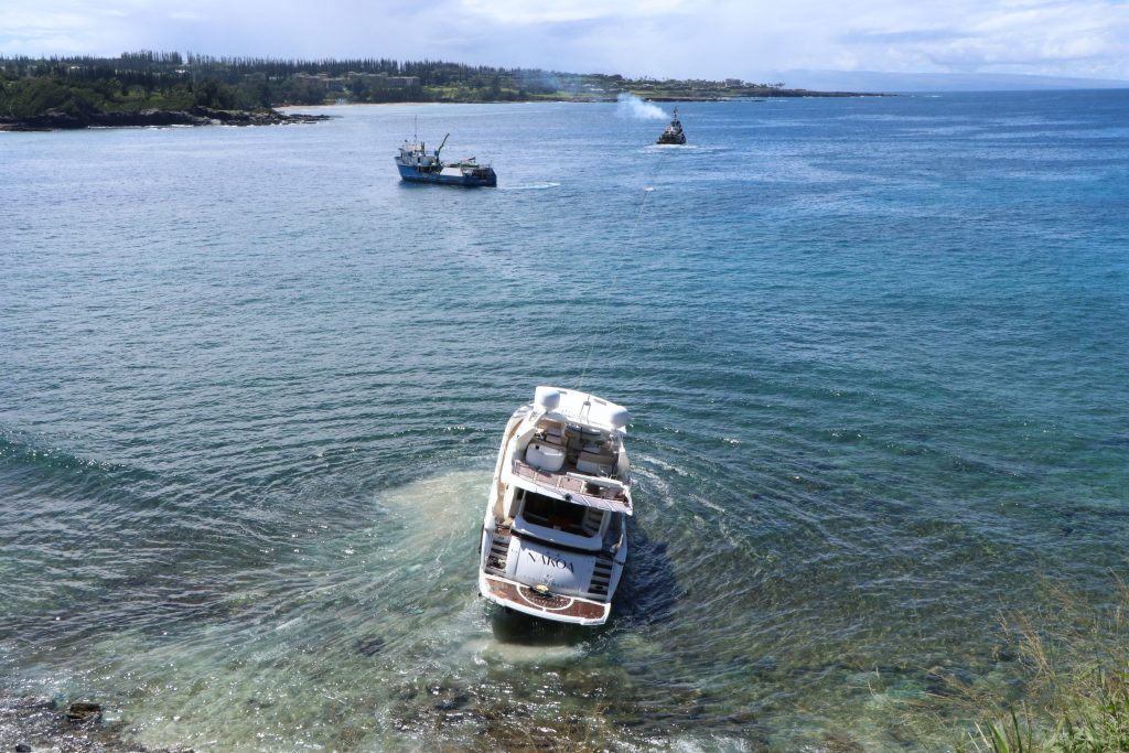 Grounded yacht pulled from Maui rocks after two weeks