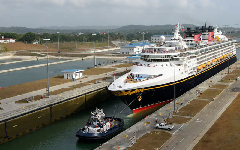 A ship assist tugboat guides a cruise ship into a lock within the Panama Canal. A recent incident close call between a tug and a ship has raised safety concerns.