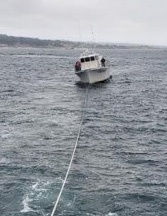 Tour boat towed after possible engine fire off Monterey