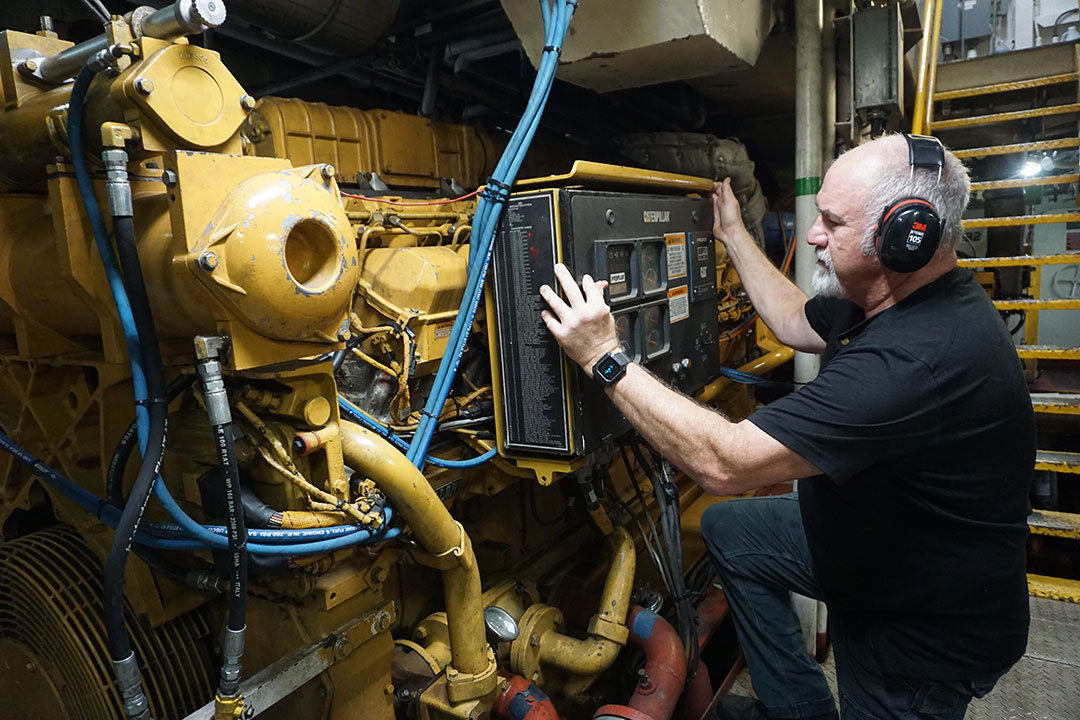 Engineer Kevin Anderson, a Coast Guard veteran, monitors the operations of Savannah’s twin Caterpillar 3516B engines.