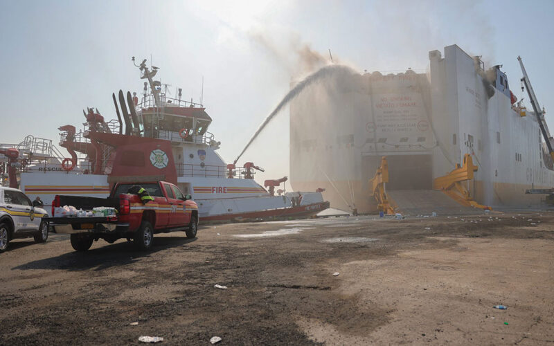 A Newark fireboat aims a stream of water onto the burning Grande Costa d’Avorio.