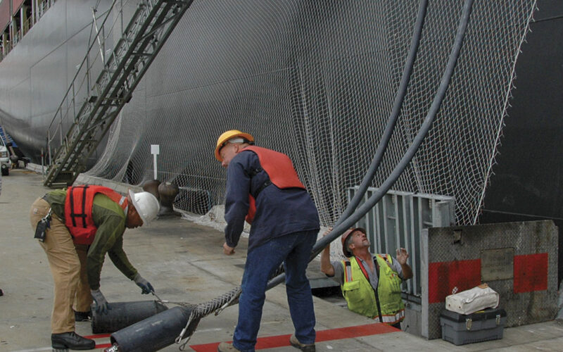 Workers at the Port of Oakland prepare to plug-in a ship berthed at the Ports America Outer Harbor Terminal. Right, Tim Leong, the Port of Oakland’s senior maritime projects administrator.