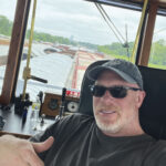 Capt. Kyle Pfenning in the wheelhouse of the MV Stone Strait.