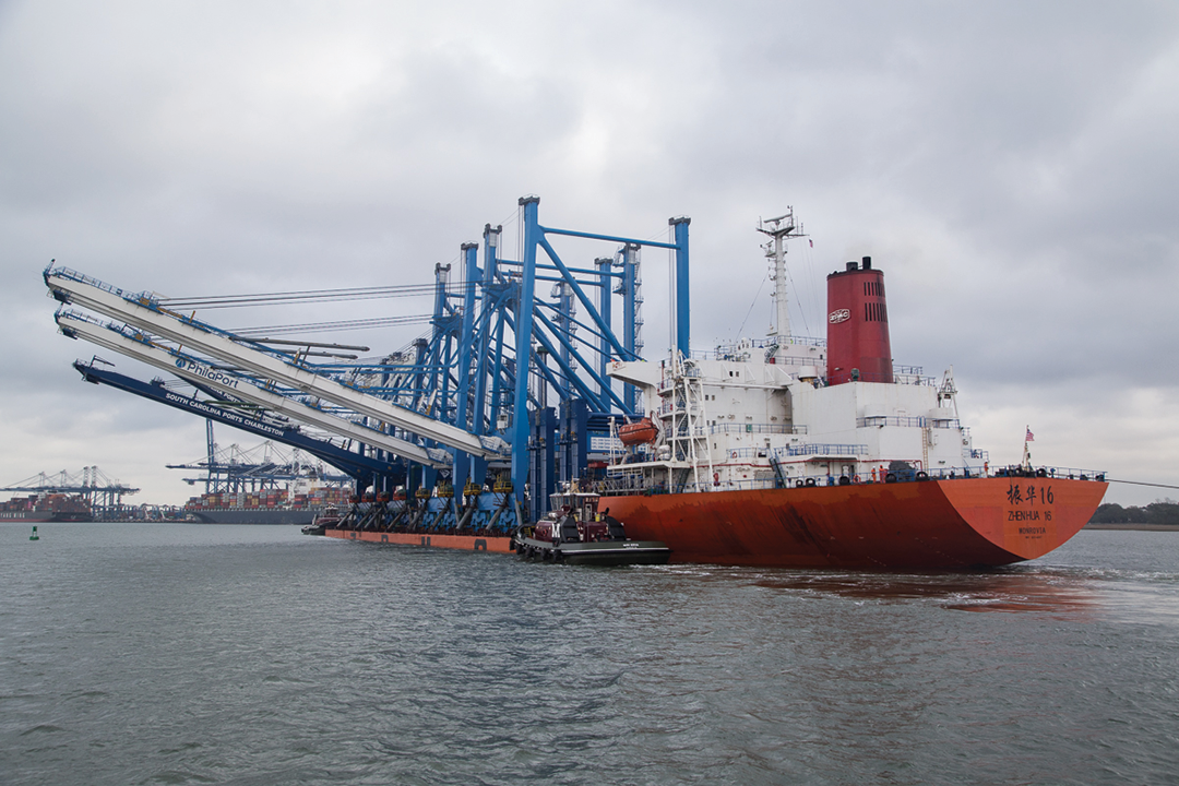 Three new container cranes aboard a heavy-lift ship arrive at the Port of Charleston.