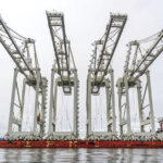 Four fully-assembled, 155-foot, Chinese-made container cranes arrive at the Port of Seattle.