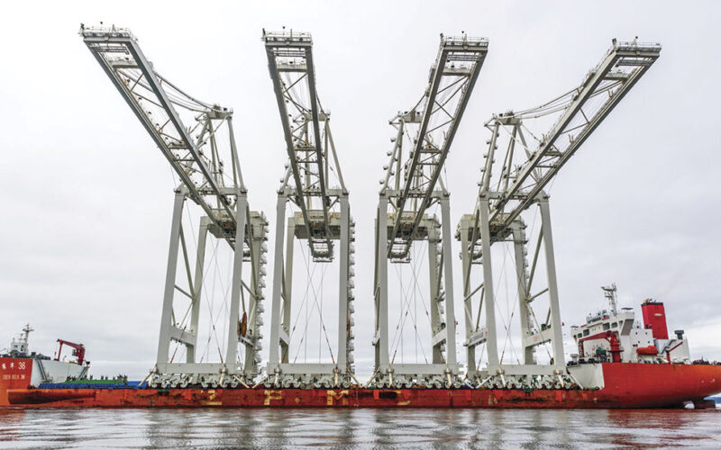 Four fully-assembled, 155-foot, Chinese-made container cranes arrive at the Port of Seattle.