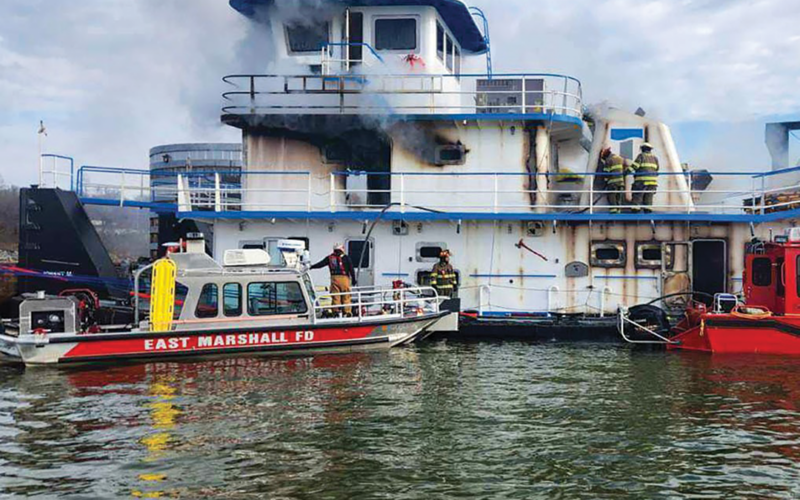 Firefighters battle an engine room fire aboard the Johnny M on Kentucky Lake, just south of Kentucky Lock.