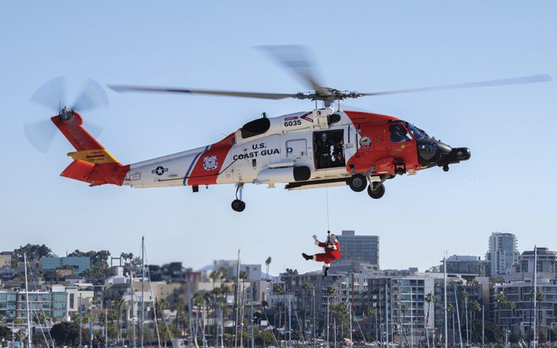 Santa Claus descends from a HH-60 Jayhawk at U.S. Coast Guard Sector San Diego on Dec. 7, 2024, as part of the Santa FlyOver morale event for Sector San Diego’s personnel and their families.