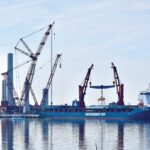 The New Bedford Marine Commerce Terminal, as seen in 2023 during final construction of Vineyard Wind 1. The New England-based wind farm was among several U.S. offshore wind projects temporarily halted by federal stop-work orders in late 2025 before court rulings allowed construction to resume.
