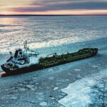 A ship operating in ice-covered waters, where new Polar Code requirements emphasize voyage planning, ice awareness and operational preparedness.