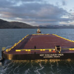 The ocean tug Rachel maneuvers NSF Discovery Pier into Lyttelton, New Zealand, in late January, before departing for Antarctica. The 328-by- 100-foot structure was towed more than 9,200 miles from Portland, Ore., to McMurdo Station following multiple stops, including the South Island port.