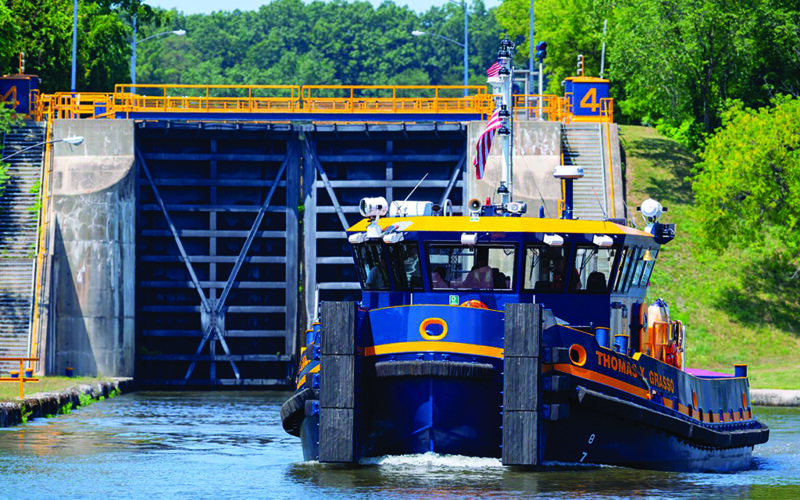 Thomas X. Grasso near a lock on the New York State Canal System. One of four new tugboats being introduced by Canal Corp., the vessel supports maintenance, including icebreaking, across nearly 500 miles of waterways.