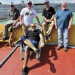 Capt. Harris, foreground, with his crew (from left): Andrew Brunner, deckhand; Bobby Brown, mate; Lee Price, deckhand; and Jimmy Pate, engineer.