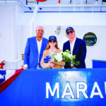 Representatives from Master Boat Builders and Maritime Partners gather at the christening of Marauder, the first vessel in an eight-tug construction program. Pictured from left are Garrett Rice, president of Master Boat Builders; Alison Parker Carmel, sponsor of the vessel and wife of MarAd Administrator Stephen Carmel; and Bick Brooks, CEO of Maritime Partners.