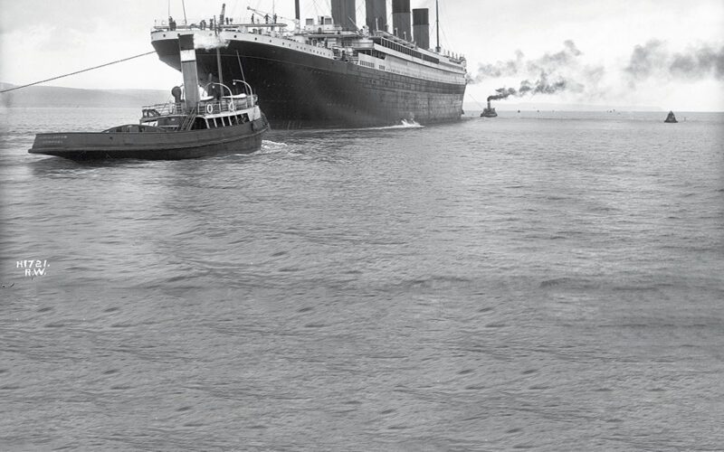 HMS Titanic departs Belfast, Ireland, on April 2, 1912, less than two weeks before its tragic sinking. Five tugs assisted the liner’s departure, although only two are visible in this image.