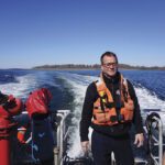 Capt. Christopher Alves poses for a portrait in Diamond Pass near Peaks Island, Maine.