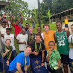 Capt. Samar Bannister, front left, joins Golden Bear cadets and local residents during a stop in Fiji on the ship’s 65-day summer training cruise through the Pacific.